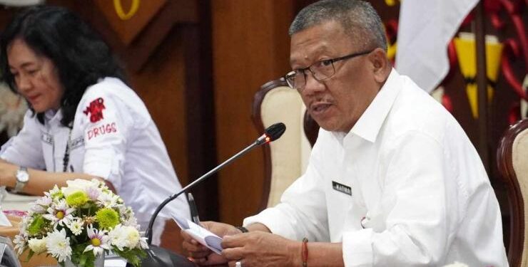 FOTO : IST ADPIM/MATAKALTENG - Asisten Gubernur Kalteng Bidang Pemerintahan dan Kesra Katma F. Dirun saat membuka Rakor dan Sinkronisasi Program P4GN dan PN Tahun 2023.
