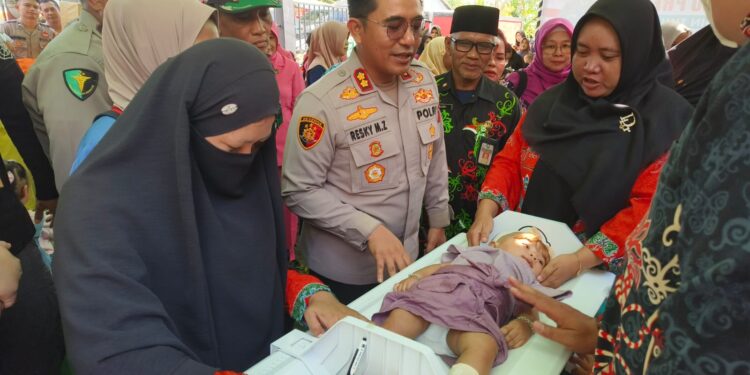 Foto:IST/MATA KALTENG - Gebyar Posyandu Presisi Polres Kotim dalam rangka Percepatan Penurunan Stunting Kabupaten Kotim di Kantor Desa Pelangsian, Kecamatan MB Ketapang, 22 Mei 2025.